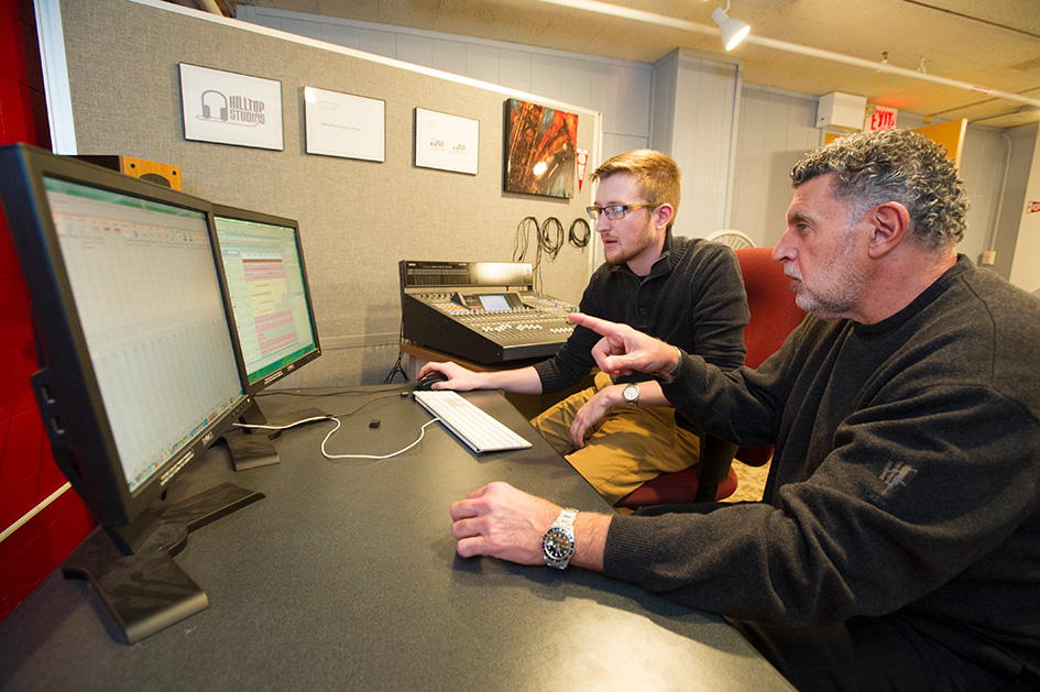 A Bradley University music professor works with a student. 