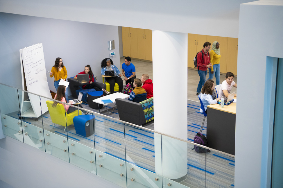 Students working together inside the Business and Engineering Convergence Center at Bradley University. 